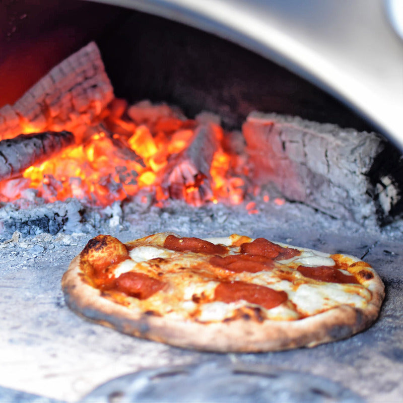 close up of pizza in wood fired oven