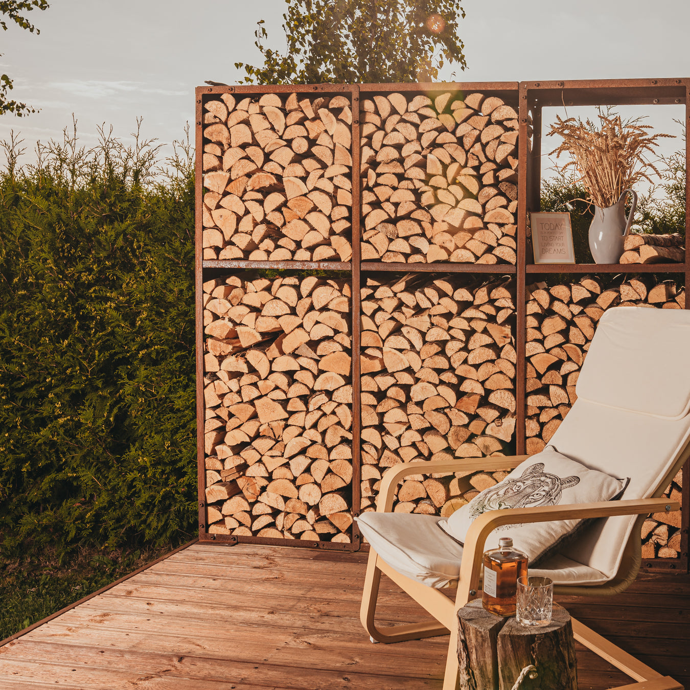 large outdoor wall log store on decking
