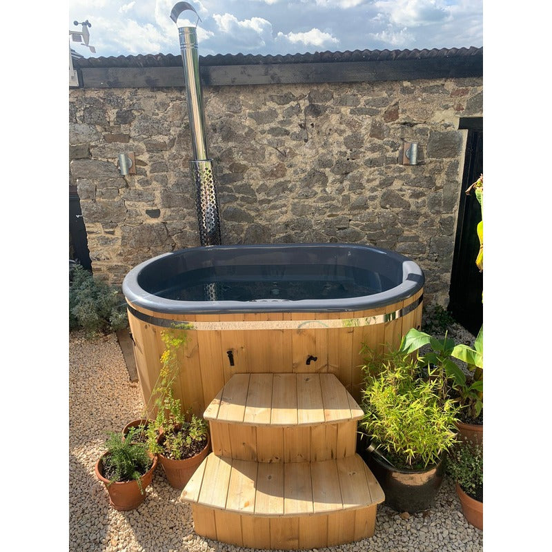 2 person hot tub ofuro side view in garden with steps