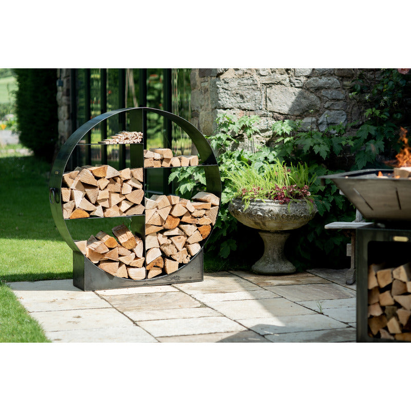 Circular Log Store Firepits UK 120cm with logs on patio