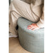 Cosipouf Heated Comfort Green Low Round 60x38cm high woman sitting