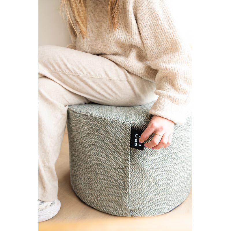 Cosipouf Heated Comfort Green Low Round 60x38cm high woman sitting with label