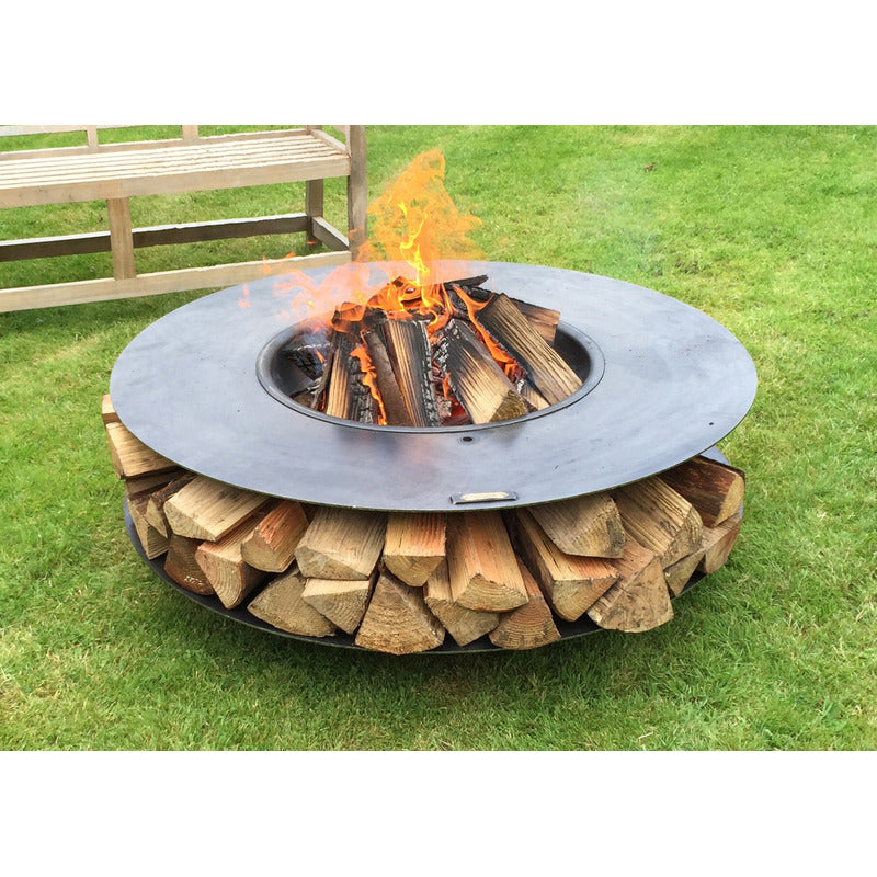Firepits UK Flat Ring of Logs 120 with Swing Arm BBQ Rack lit with logs