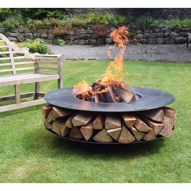 Firepits UK Flat Ring of Logs 120 with Swing Arm BBQ Rack with logs burning