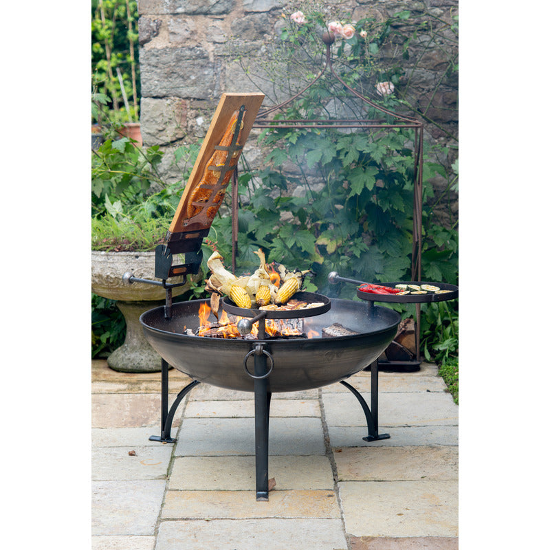 Firepits UK Plain Jane 90 with Three Swing Arm BBQ Racks with food and salmon plank