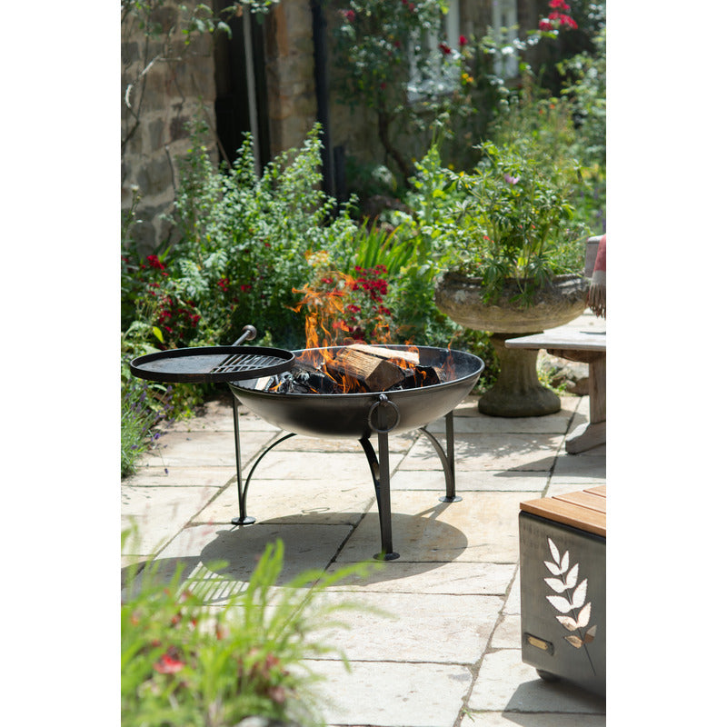 Firepits UK Plain Jane with Swing Arm BBQ Rack Fire Pit Collection no food, logs burning