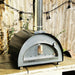 Igneus Pro 600 wood-fired pizza oven garden view on paving