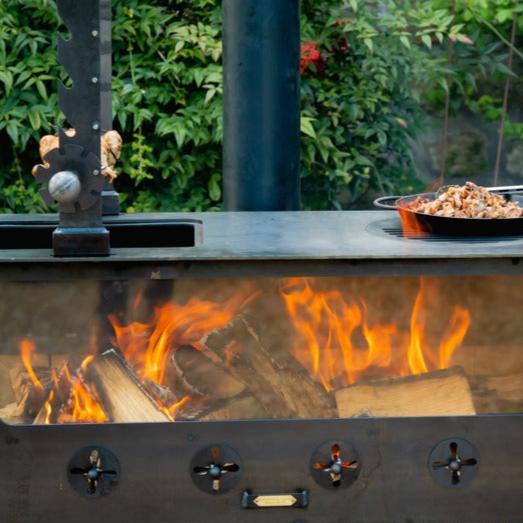 Large Outdoor Wood Burner BBQ Firepits UK front view cooking food