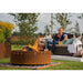 GrillSymbol Corten Steel Fire Pit Legend, ø 116 cm fire lit with family