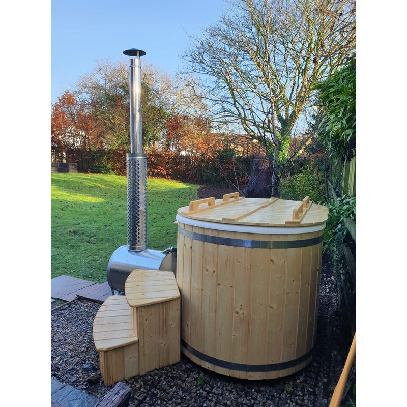 Ofuro 2 person hot tub side view in garden with wood burner and wooden cover