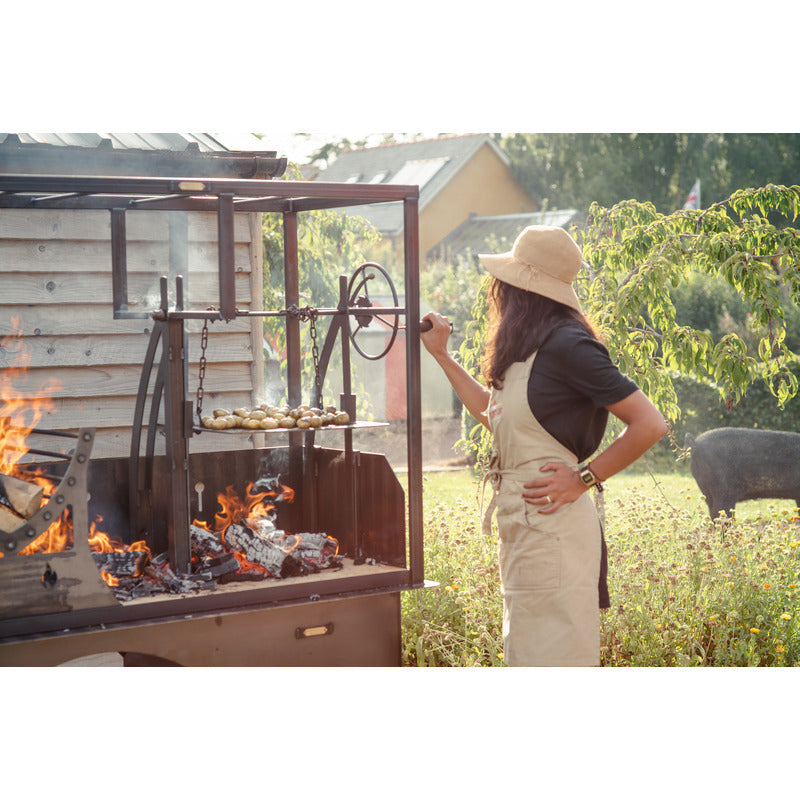 Asado Primera BBQ – The Banquet Firepits UK cooking potatoes