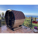 angled side view of barrel sauna with sea view 