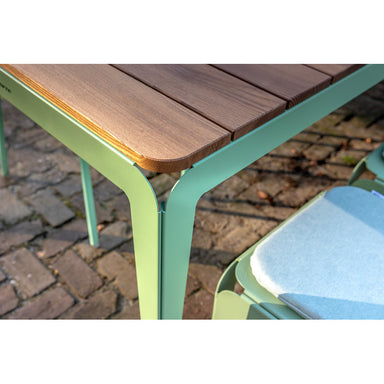 close up of bended table in green corner