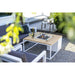 cosiloft 100 fire pit table in white flames outside with chairs
