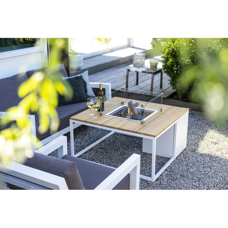 cosiloft 100 fire pit table in white flames outside with chairs