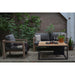 cosiloft 100 fire pit table teak top side view in garden