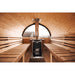 end view of benches and heater in barrel sauna