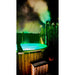 hot tub elite wood fired nightime view with led lights on 