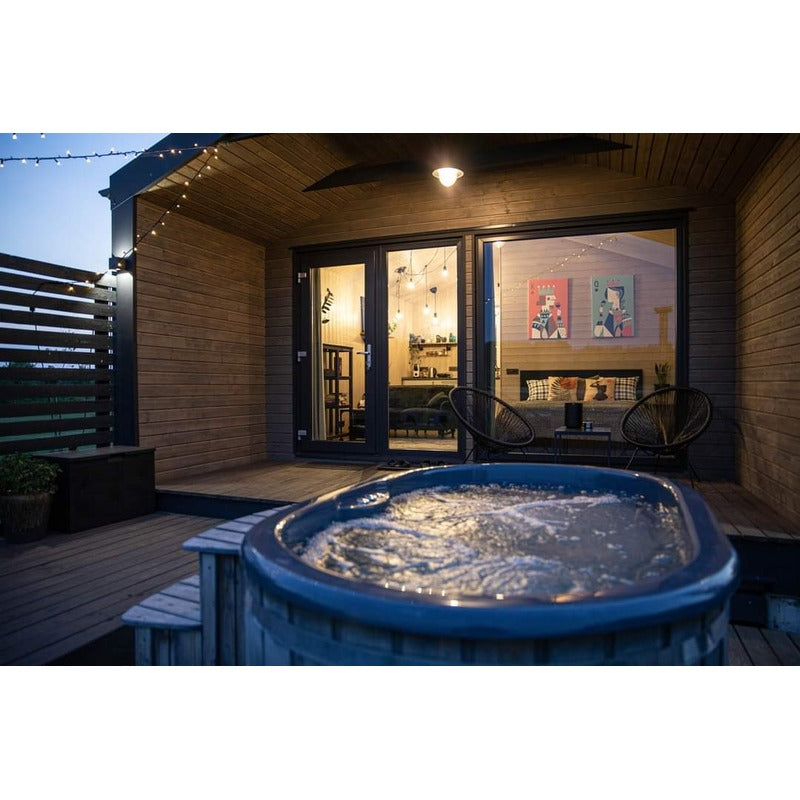 ofuro 2 person tub with jets active in cabin setting