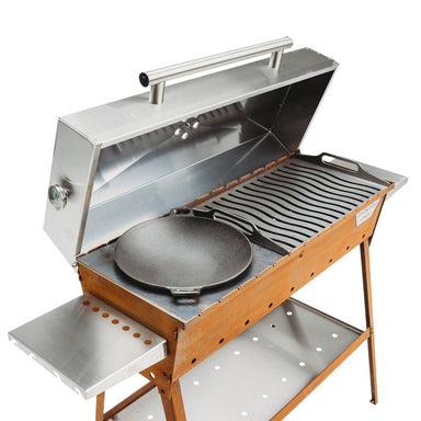studio view of grill symbol charcoal grill lid open with wok pan