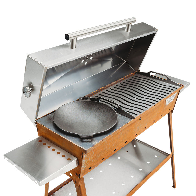 studio view of grill symbol charcoal grill lid open with wok pan