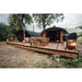 two hobbit sauna cabins side by side on decking