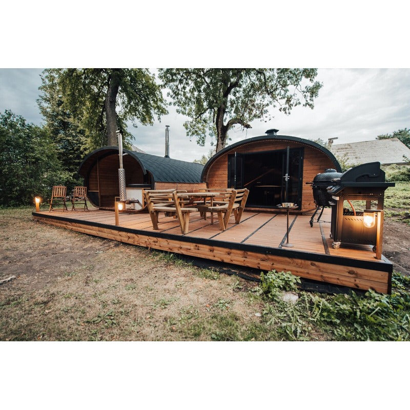 two hobbit sauna cabins side by side on decking